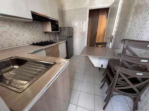 a kitchen with a sink and a counter top at Appartement Bizerte Nord in Bizerte