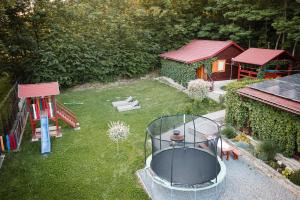an aerial view of a backyard with a playground at Cabana Toth Mic&Mare in Sovata
