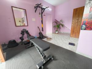 a room with a gym with two exercise bikes at Sunrise Strength Club in Villupuram
