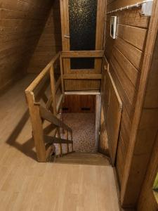 an overhead view of a staircase in a wooden house at Pogórzański Domek in Ciężkowice +9 photos