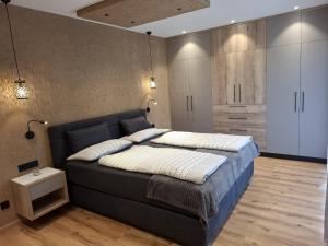 a bedroom with a large bed in a room at Residence Wiesenheim in Trodena +131 photos