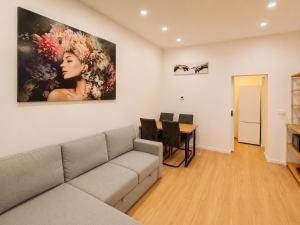 a living room with a couch and a table at City Line Koblenz in Koblenz