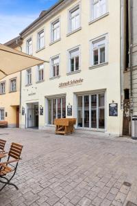 a building with benches in front of it at Hopfenquartier Altstadt in Bamberg