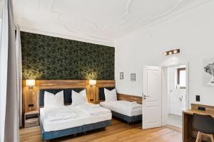 a hotel room with two beds and a desk at Hopfenquartier Altstadt in Bamberg +56 photos