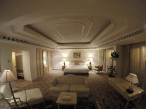 Ένα ή περισσότερα κρεβάτια σε δωμάτιο στο Hofuf Hotel