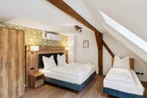 a bedroom with two beds in a attic at Hopfenquartier Altstadt in Bamberg