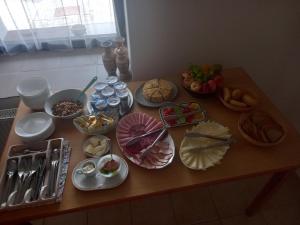a table with many different types of food on it at Penzion Skřítkův grunt in Struhařov +14 photos