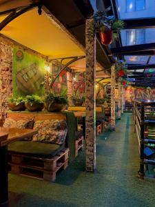 a restaurant with tables and plants on the walls at Timeout Heritage Hotel Zagreb in Zagreb +41 photos