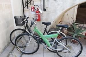 two bikes parked next to a wall with a fire extinguisher at Borgo Antico in Diso