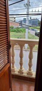 an open window with a view of a street at Ciudad de Nieva a pasos de Ciudad Cultural in San Salvador de Jujuy +1 photo