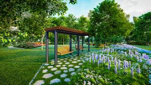 a gazebo with a bench in a park with purple flowers at Boho Quiet Studio Kraków in Krakow
