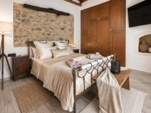 a bedroom with a large bed with a floral wall at Villa Katrinia in Sitia +40 photos