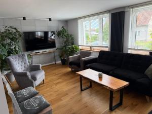 a living room with a couch and a coffee table at Ten Dom in Malbork