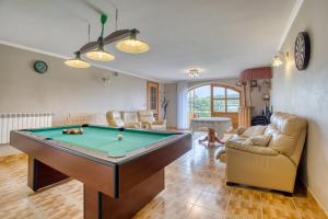 a living room with a pool table at Domki u Marii- agroturystyka in Bańska Niżna