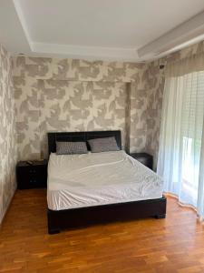 a bedroom with a bed in a room with camouflage wallpaper at Atlantic Beach View Villa in El Jadida +34 photos
