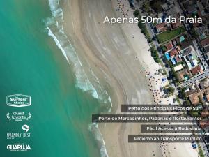 an aerial view of a beach and the ocean at HOSTEL QUINTAL GUEST - Guarujá in Guarujá