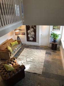 a living room with a couch and a rug at Countryside Cottage in Ardee