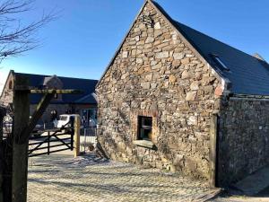 a large stone building with a window in it at Countryside Cottage in Ardee