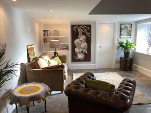 a living room with two couches and a table at Countryside Cottage in Ardee