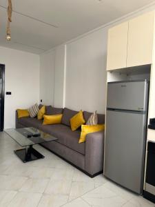 a living room with a couch and a table at Stodio sofia in Essaouira