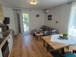 a living room with a couch and a table at A & B apartment in Lovran