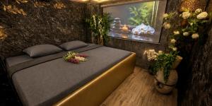 a bedroom with a bed with flowers on it at Sofia Private Wellness Apartman Prague - Sauna & Jacuzzi in Prague