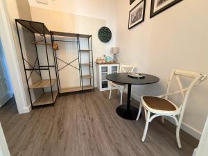 a dining room with a table and chairs and a shelf at Lisbon Downtown Inn in Lisbon +86 photos