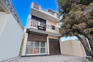 a building with aoc sign on the front of it at SPOT ON VS in Delhi +21 photos