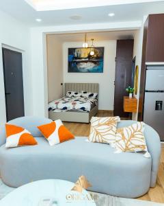 a living room with two beds and a couch at ORIGAMI APARTMENTs in Boi