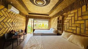 a bedroom with a bed and a window at Mây Retreat in Nguyên Ngoại +72 photos