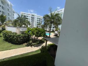 a view of a resort with a pool and buildings at Tepuy Residential in Juan Dolio