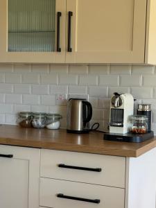 a kitchen counter with a coffee maker and a toaster at The Old Tearooms in Rural Northumberland in Edlingham +31 photos