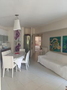 a bedroom with a table and chairs and a bed at Evi's house in Iraklitsa