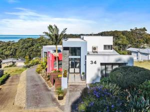 an aerial view of a house with the ocean in the background at Seabreeze Sanctuary in Long Beach