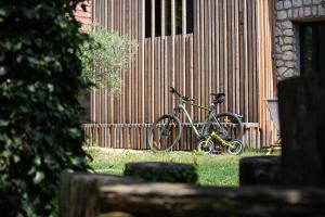 a bicycle is parked next to a building at Sklep Mozajka in Velké Bílovice