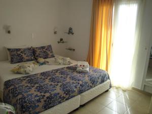Postel nebo postele na pokoji v ubytování Rodon Apartments