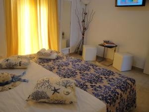 Postel nebo postele na pokoji v ubytování Rodon Apartments
