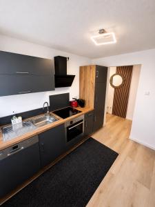 a kitchen with a sink and a counter top at Ferienwohnung Laufenburg in Laufenburg