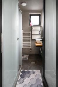 a bathroom with a sink and a mirror at Black Villa in Prizren +15 photos