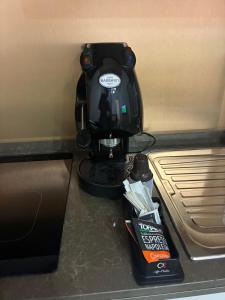 a mixer sitting on top of a counter next to a bed at Almarè in Grottammare