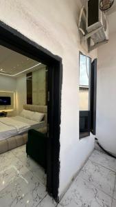 a bedroom with a bed and a tv and a window at Emilomo beautiful homes in Cardoso