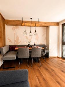 a dining room with a table and chairs at NEU ab Juli 2026 - Apart Kneringer in Prutz
