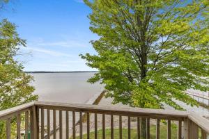 a deck with a view of the water at Upper Level Lakeview suite in Lake City