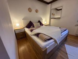 a bedroom with a large bed in a room at Max and Moritz Top 7 in Liebenau