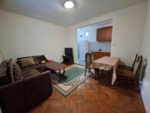 a living room with a couch and a table at Mareza in Podgorica