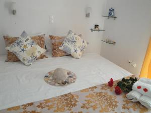 Postel nebo postele na pokoji v ubytování Rodon Apartments