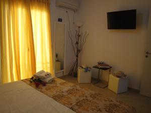 Postel nebo postele na pokoji v ubytování Rodon Apartments