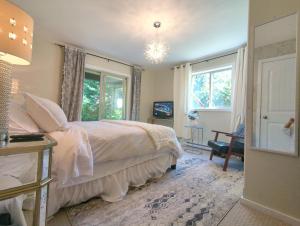 a bedroom with a bed and a window at Davidson Lake House in Sooke +37 photos