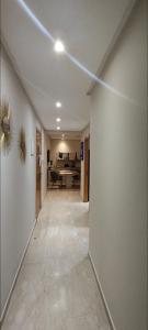 an empty hallway with a living room in a house at infinity by Ghita in Rabat +12 photos