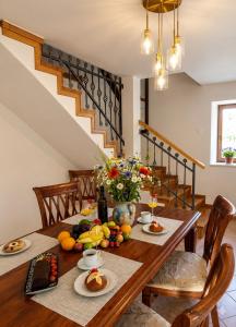 a dining room table with fruits and vegetables on it at Villa Nona Tamara with Astonishing Sea & Mountains View in Bribir